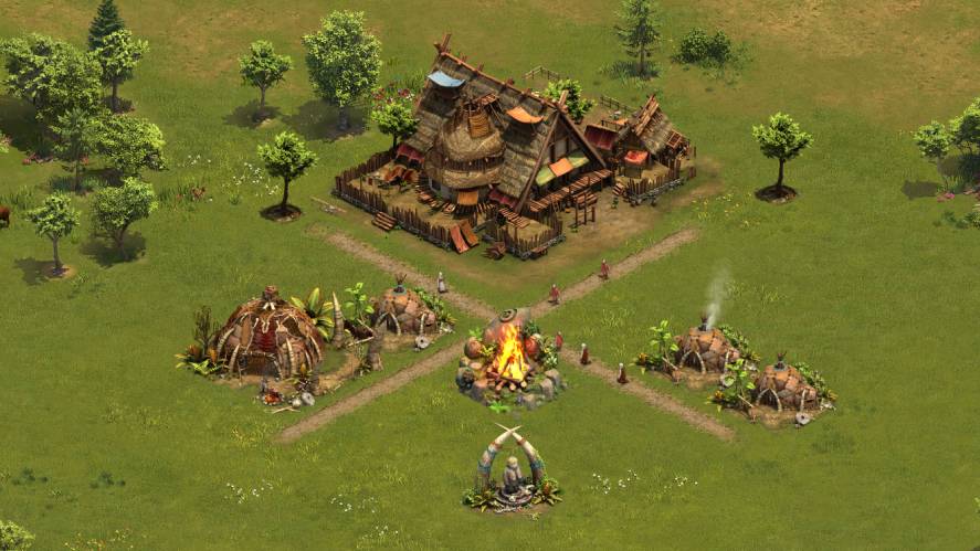 A top-down strategy gameplay screenshot from Forge of Empires, showcasing an early-game tribal settlement featuring rustic thatched-roof huts, a central campfire, primitive structures, and dirt paths set within a lush, green landscape dotted with trees.