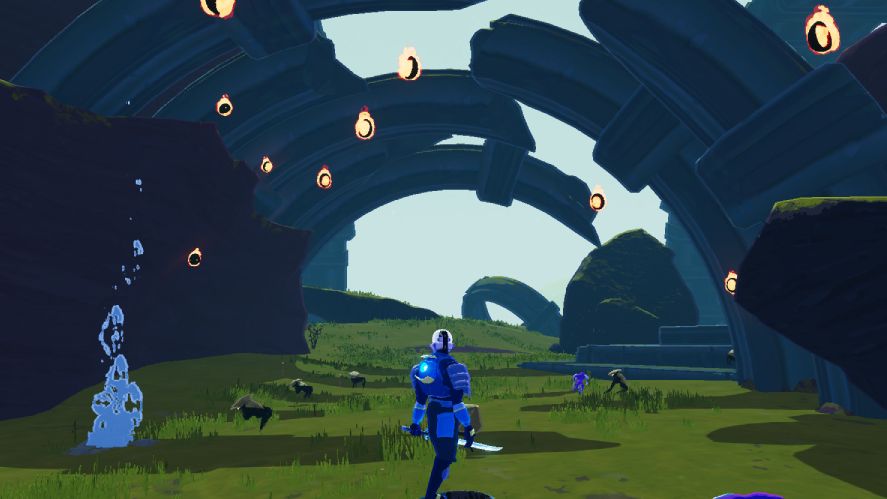 A third-person gameplay screenshot from Risk of Rain 2 showing the Commando character standing on a teleporter platform in a grassy, alien landscape featuring giant curved stone ruins, floating fiery wisps, and small enemy creatures scattered about.
