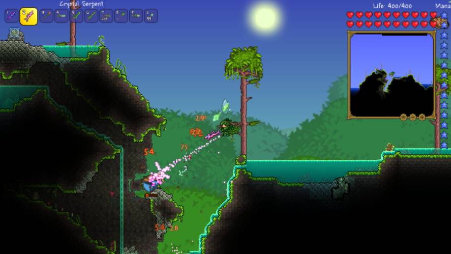 A 2D side-scrolling sandbox gameplay screenshot from Terraria, showing a player character in a jungle biome firing the Crystal Serpent weapon to unleash a stream of pink crystal projectiles at an enemy, with UI elements displaying health, mana, hotbar items, and a mini-map in the top corners.